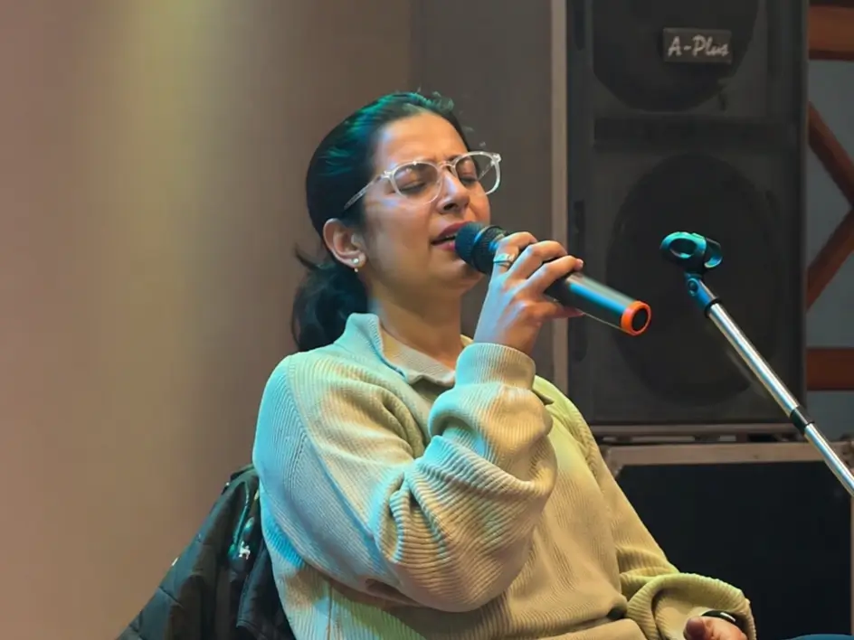 Live female singer entertaining guests with acoustic performance at an event