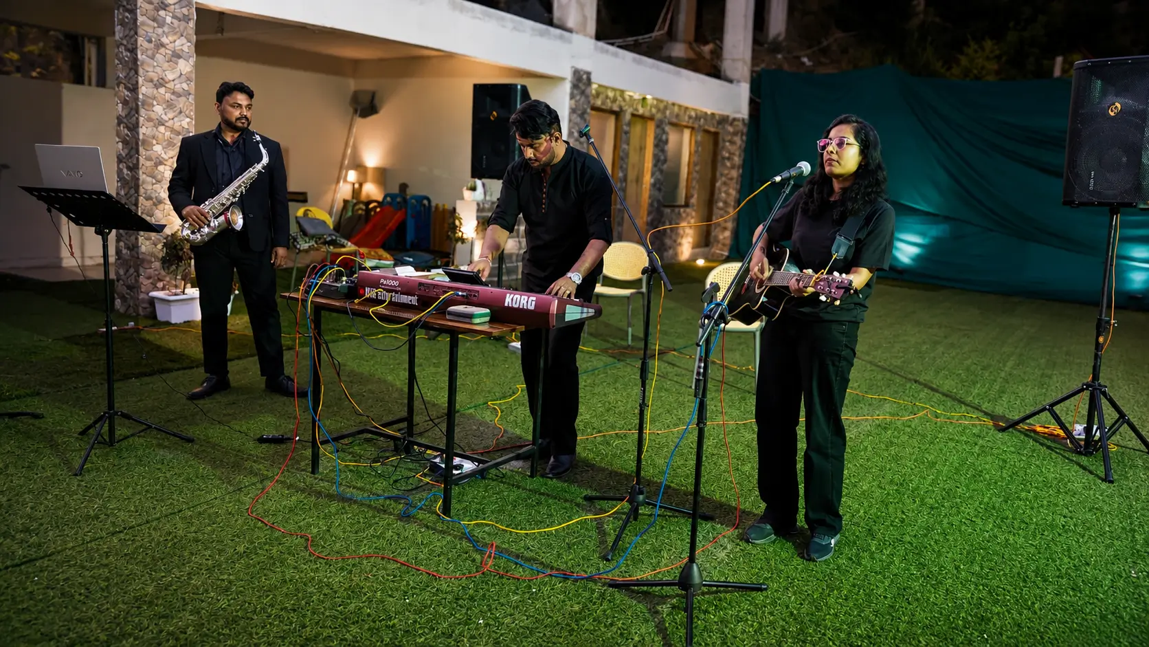 Female wedding singer in Shimla performing live with musicians during a destination wedding and event celebration.