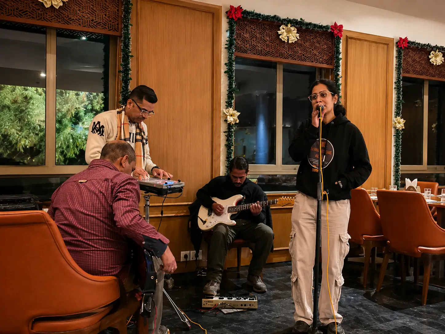 Live singer in Chandigarh performing with a live band at an event, creating memorable entertainment for weddings, corporate functions, hotels, cafés, and private parties.